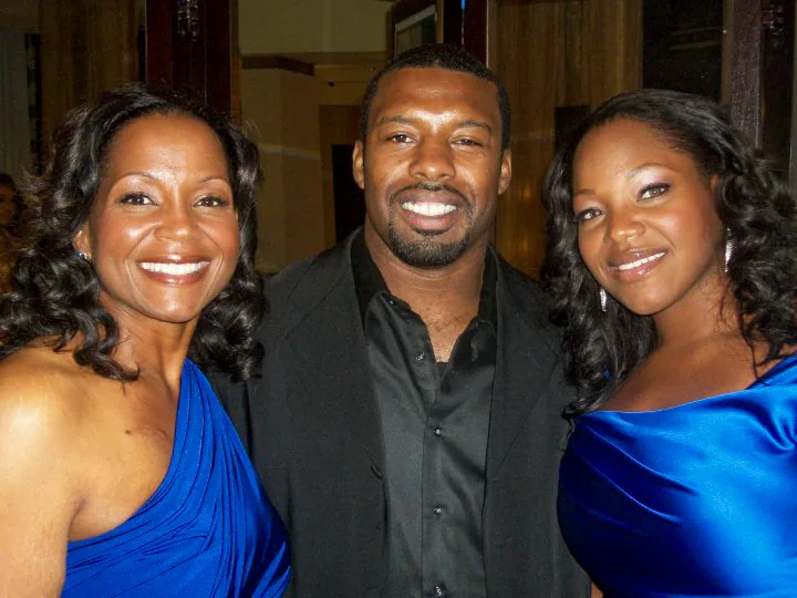 Coach Cal with Cherita and Victoria Andrews at an event